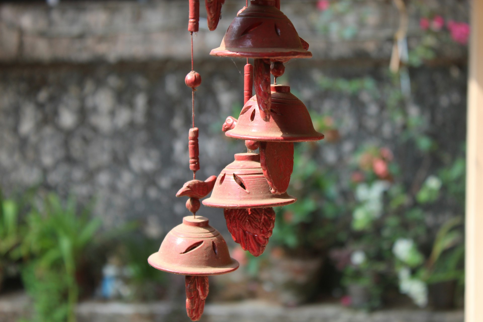 a group of bells hanging from a building